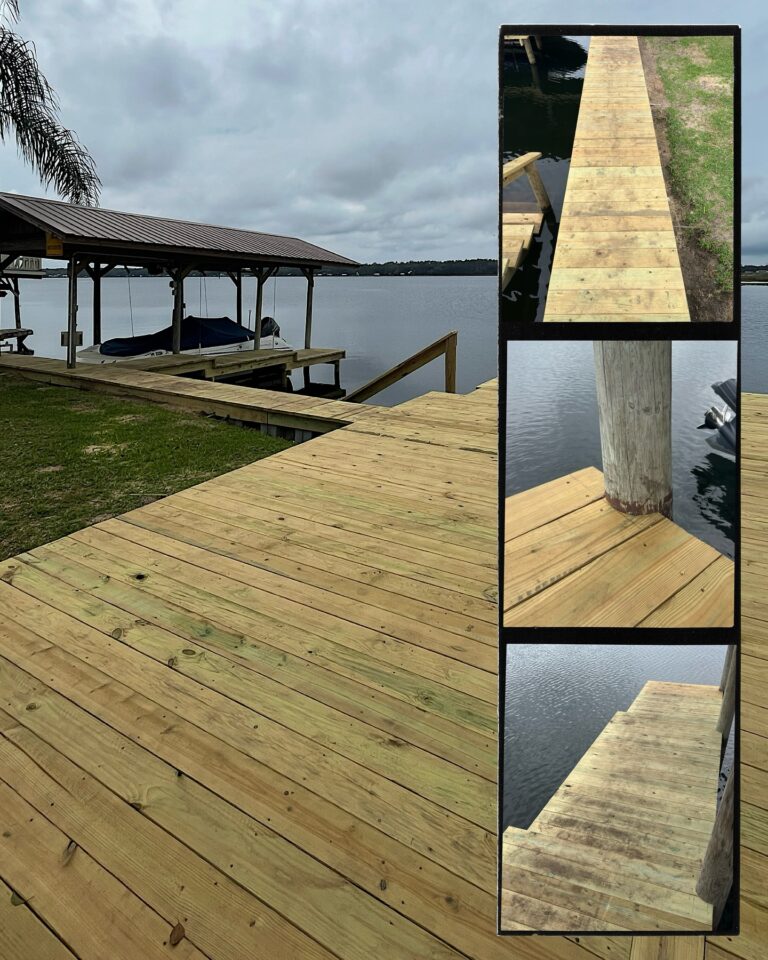 Wooden dock by a calm lake with a boat under a shelter and grassy bank in the background, cloudy sky above