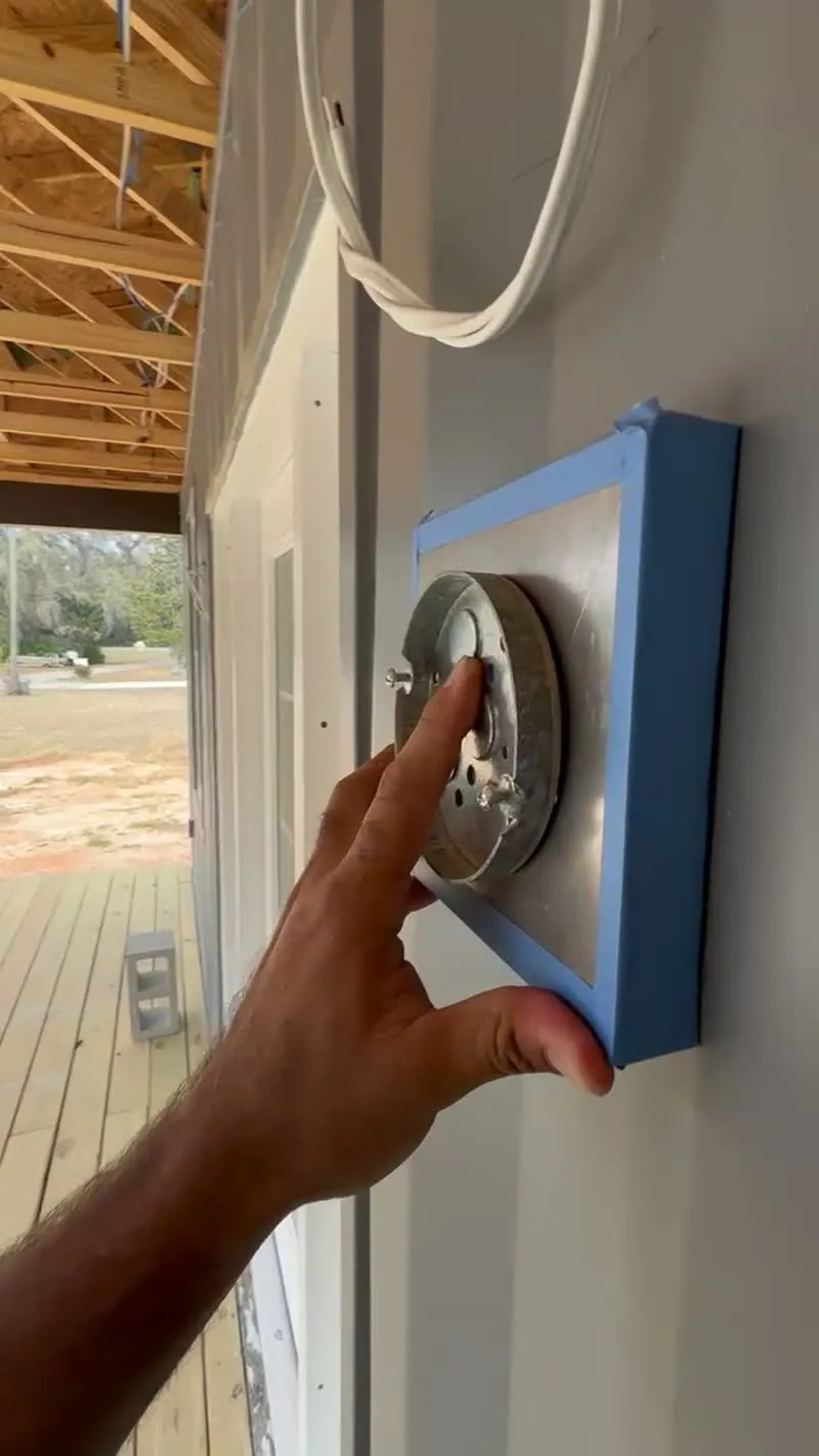 JSC crew protecting fixtures during container home construction