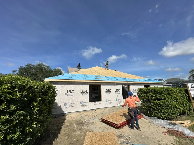 Crew installing roof sheathing on a home addition in The Villages, Florida, by JSC Contracting